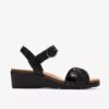 Damen-Kacha-Twist-Keilabsatz-Sandaletten aus schwarzem Leder Damen-Kacha-Twist-Keilabsatz-Sandaletten aus schwarzem Leder